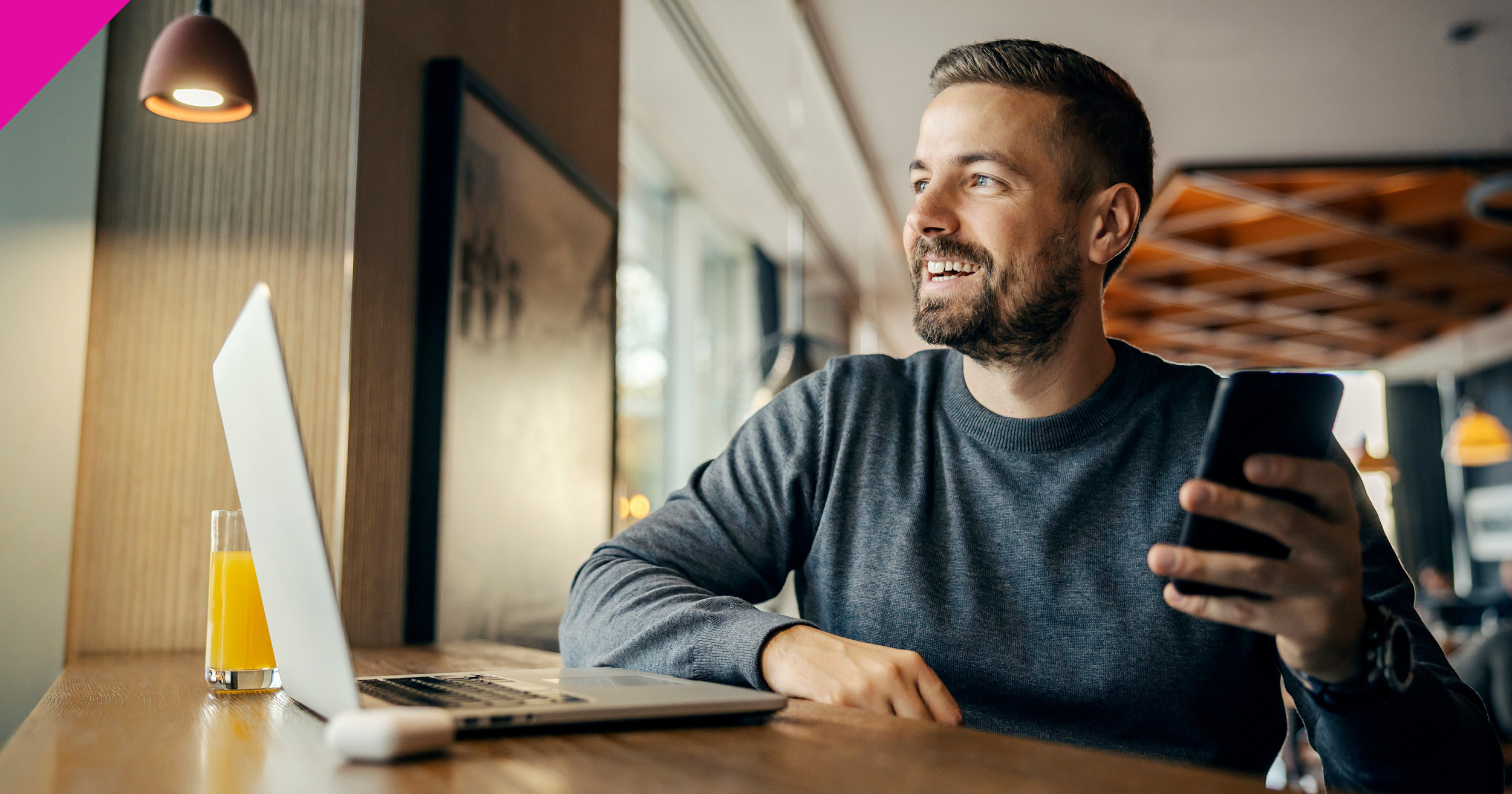 Man sat at desk looking at laptop