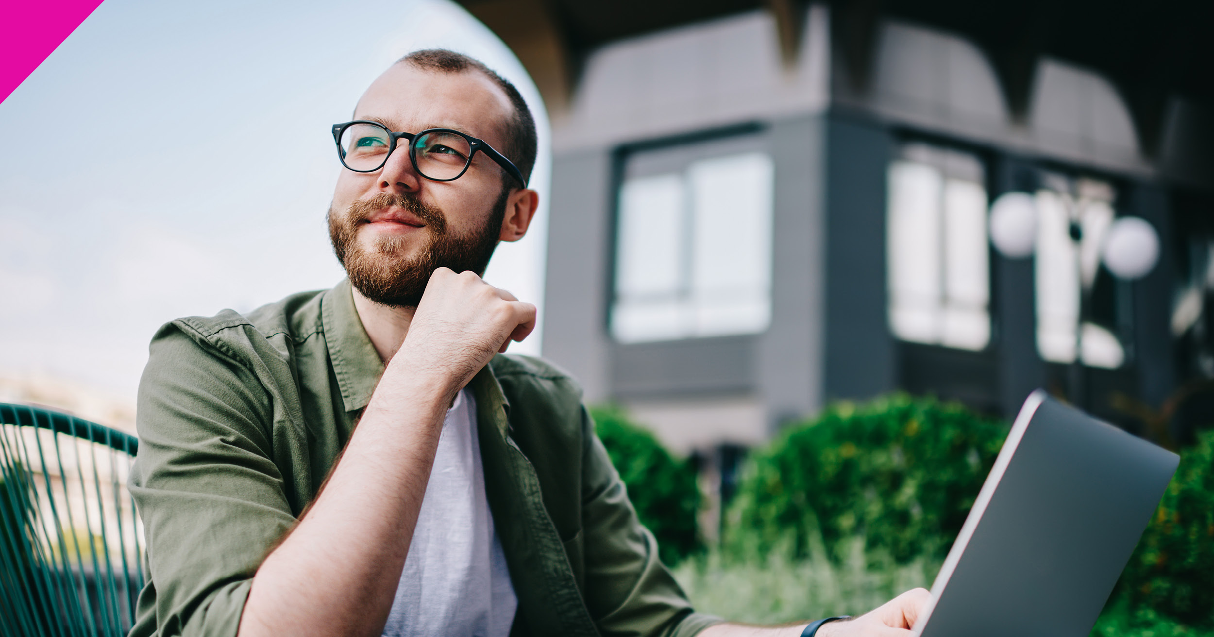 Man sat outside on laptop