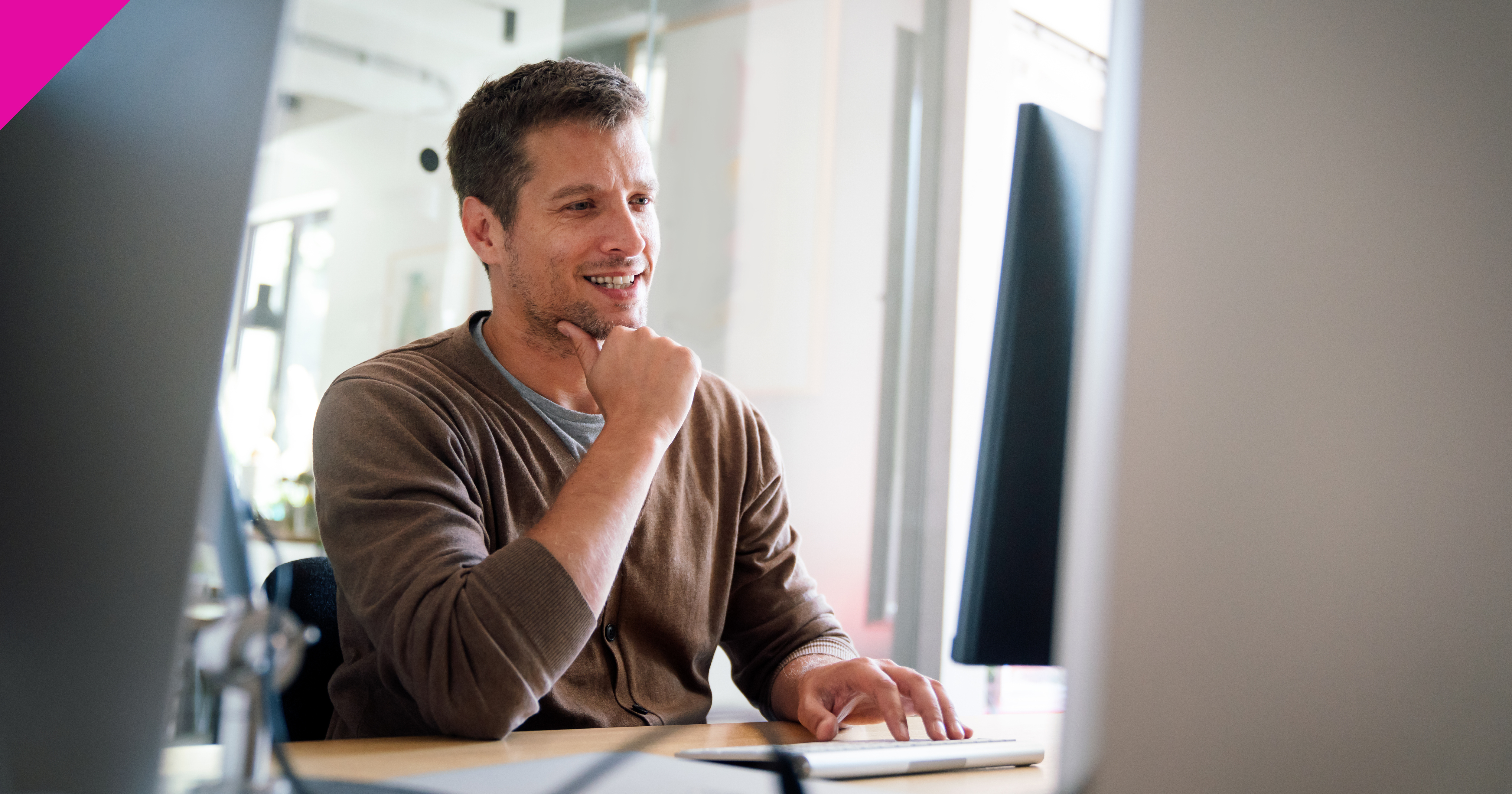 Man sat looking at computure screen